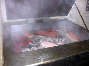 Brats and lunchmeats in cooker for boiling